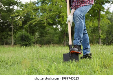 Worker Digging Soil With Shovel Outdoors, Closeup