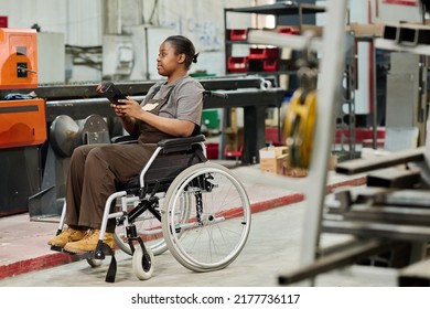 Worker With Disability Working At Machine