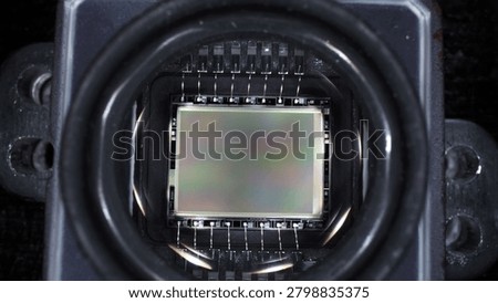worker disassembled action camera to replace matrix on board microcircuit