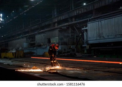 Worker doing a industrial welding at a steel mill - Powered by Shutterstock