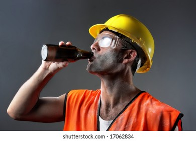 A  Worker Drink A Bottle Of Beer