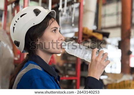 Worker drinking water in break time in factory