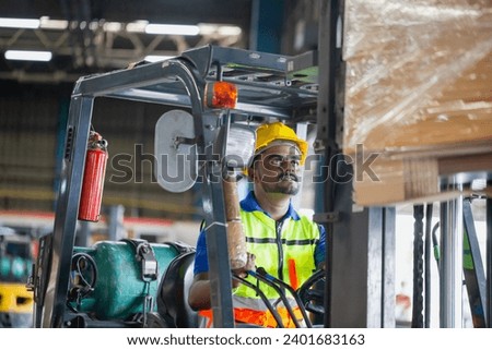 Worker driver at warehouse forklift loader works to containers box, worker man in warehouse with forklift