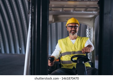 Worker Driving Forklift In Ware House