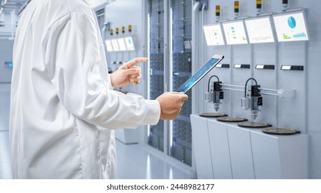 Worker or engineer wears lab coat work in semiconductor manufacturing factory - Powered by Shutterstock