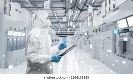 Worker or engineer wears protective suit or white coverall suit work in semiconductor manufacturing factory - Powered by Shutterstock