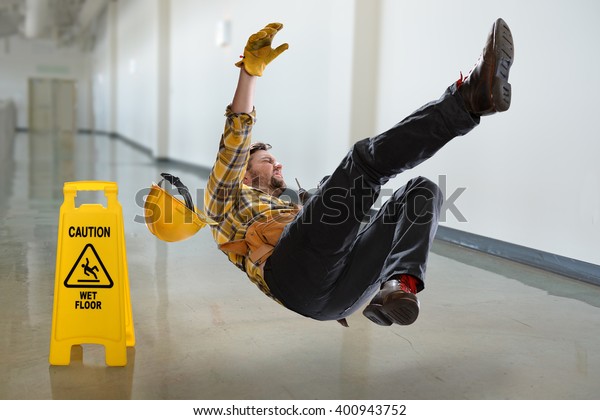 Worker falling on\
wet floor inside\
building
