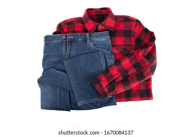 Worker Fashion; A Pair Of Denim Blue Jeans And A Red Plaid Work Shirt Isolated On White