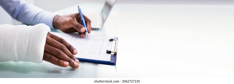 Worker Filling Social Security Benefits And Disability Insurance Compensation Claim - Shutterstock ID 2062727135