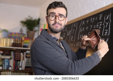 Worker With Financial Problems Shows Empty Wallet