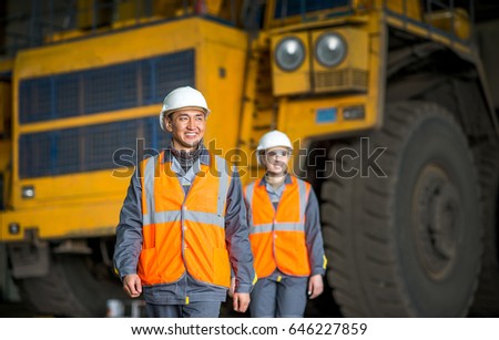 Worker in front of a bug truck