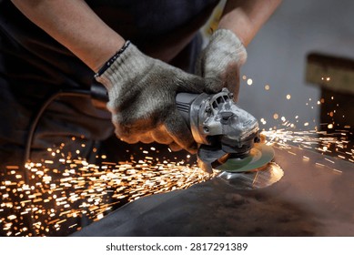 Worker grinding a metal sheet with an angle grinder as sparks fly across the workshop