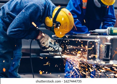 Worker Grinding In A Workshop. Heavy Industry Factory, Metalwork