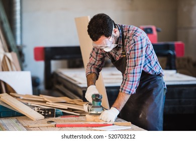 Worker Grinds The Wood Of Angular Grinding Machine