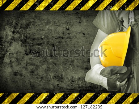 Worker and grunge texture in background. Concept of OSH (occupational safety and health)