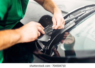 Worker Hands Installs Car Paint Protection Film