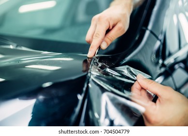 Worker Hands Installs Car Paint Protection Film