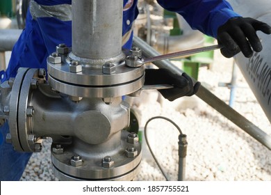 Worker Hands Screwing Nuts On Stainless Steel Pipe Is Part Of New Demineralized Water Process In Oil & Gas Plant Or Chemical Industrial.