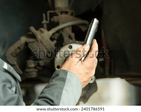 worker hands are using a smarthphone