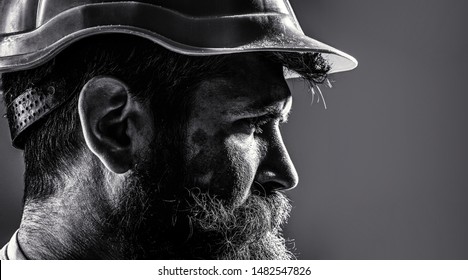 Worker In Hardhat. Portrait Mechanical Worker. Bearded Man In Suit With Construction Helmet. Portrait Of Handsome Engineer. Builder In Hard Hat, Foreman Or Repairman In The Helmet. Black And White.