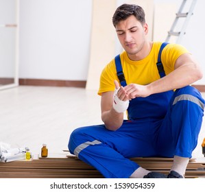 Worker With Injured Hand At Construction Site