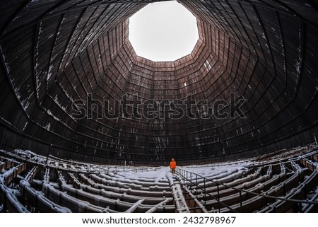 Worker inside a cooling tower