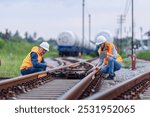 Worker Inspecting Natural Gas Freight Train at the condition of the train switch points: Rail Safety, Cargo Management, and Industrial Logistics	