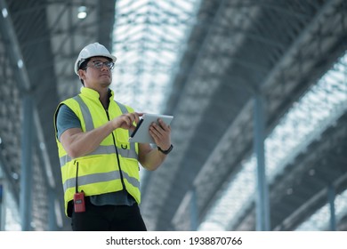 worker inspection  while in Left hand hold tablet. inspector engineer using tablet. - Powered by Shutterstock