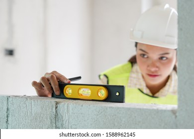 Worker, Inspector or engineer is checking and inspecting the building or house by using checklist and tooling.