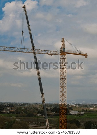 Worker installing a crane for building construction. Definitely a very risky profession.