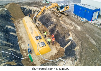 Worker Installing A Huge Fuel Tank