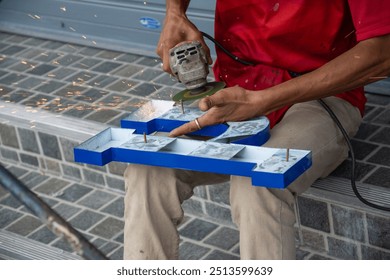 worker installing lettering on commercial metal sign  - Powered by Shutterstock