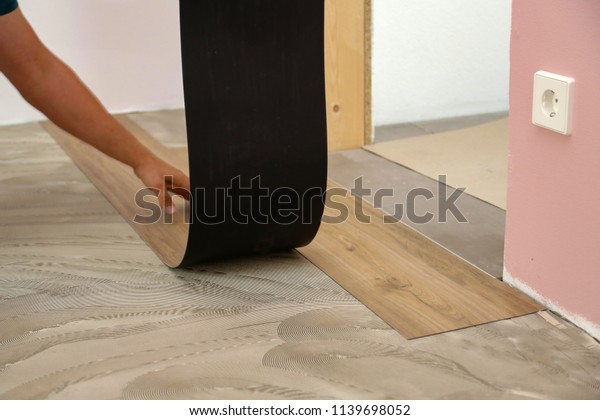 Worker Installing New Vinyl Tile Floor Stock Photo Edit Now