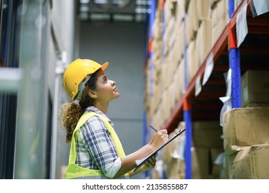 Worker inventory inspect staff checking stock and inspect package box with checklist in warehouse factory storage products shipment distributor logistic supply for counting and management - Shutterstock ID 2135855887