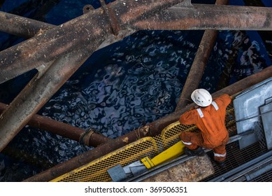 Worker at jack up oil rig leg when checking everything in rig move operation