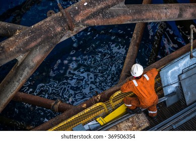 Worker At Jack Up Oil Rig Leg When Checking Everything In Rig Move Operation