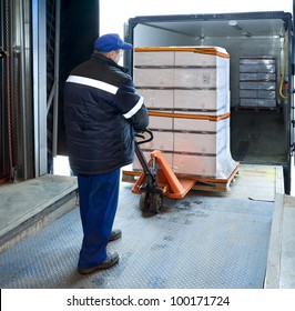 Worker Loading Truck On Forklift