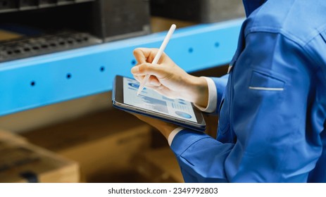 Worker looking at data on a tablet. - Powered by Shutterstock