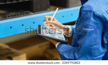 Worker looking at data on a tablet.