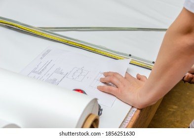 Worker makes markings PVC