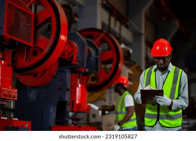 Worker or male industrial engineer Two African Americans wearing safety gear . Talk about a project in a heavy industrial plant. - Powered by Shutterstock