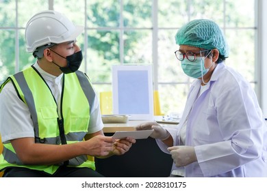 Worker man with face mask talks to nurse for healthcare consultant. Vaccination for Essential Workers in clinic healthcare at industrial factory. - Powered by Shutterstock