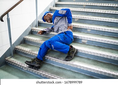 Worker Man Lying On Staircase After Slip And Fall Accident