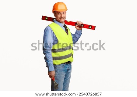 Worker Man Posing With Builder's Level Smiling To Camera Standing In Studio Over White Background. Building Equipment Concept. Copy Space