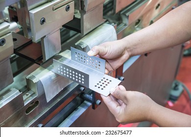 Worker at manufacture workshop operating cidan folding machine
