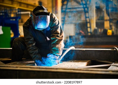 Worker With Mask Welds Details With Semi Automatic Machine