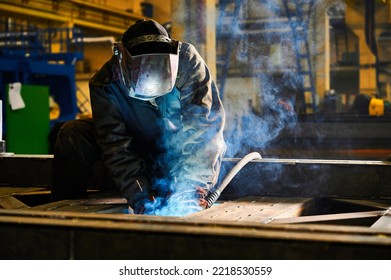 Worker With Mask Welds Details With Semi Automatic Machine