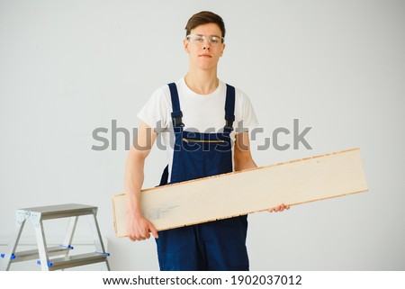 Similar – Image, Stock Photo Craftsman lays parquet flooring