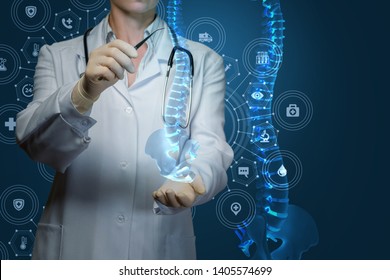 Worker of medicine treats the human spine on blue background. - Powered by Shutterstock