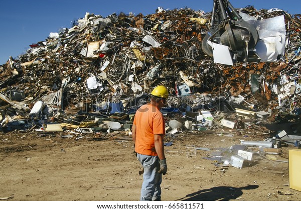 A worker at a metal recycling yard in\
Belleville, Ontario on Monday, September 11,\
2006.